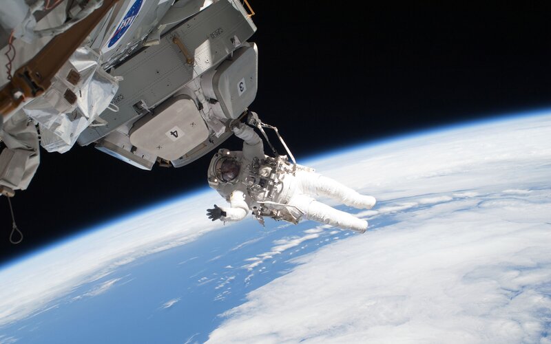 Astronaut in Space — Blue, Dramatic, Photograph, Space Station, Earth, Clouds