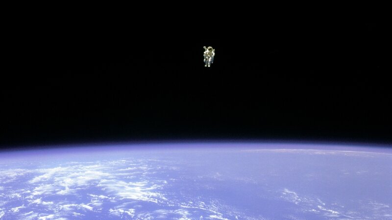 Astronaut in Space — Blue, Serene, Photograph, Earth, Clouds
