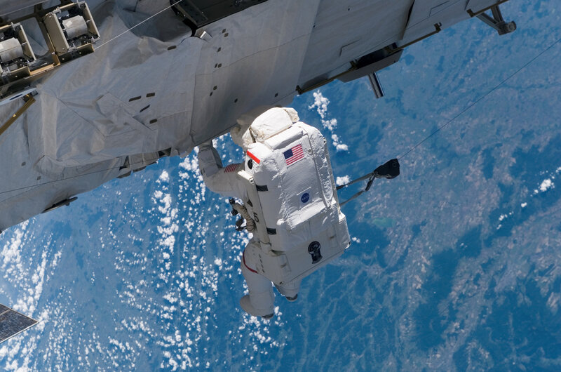 Astronaut in Space — Blue, Serene, Photograph, Space Station