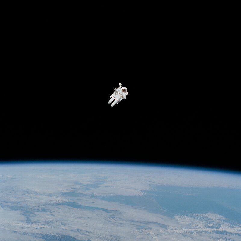 Astronaut in Space — Blue, Serene, Photograph