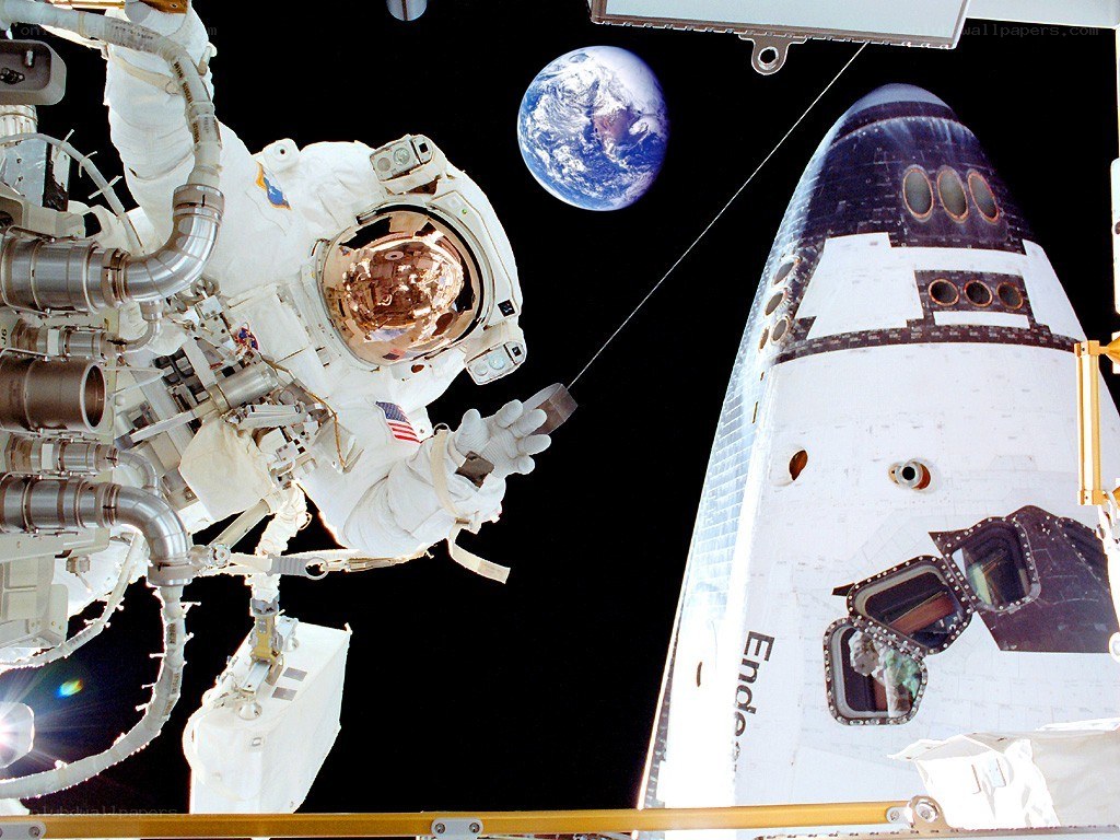 Astronaut in space near shuttle