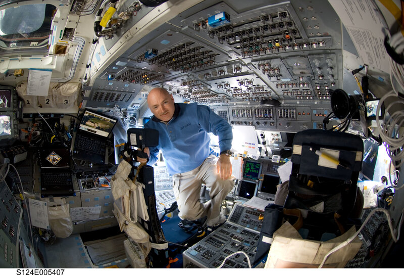 Astronaut in space station cockpit