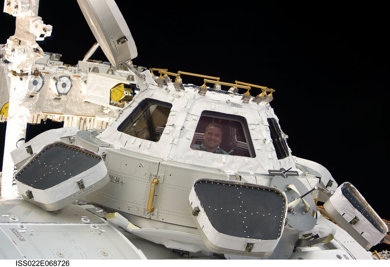 Astronaut in space station module
