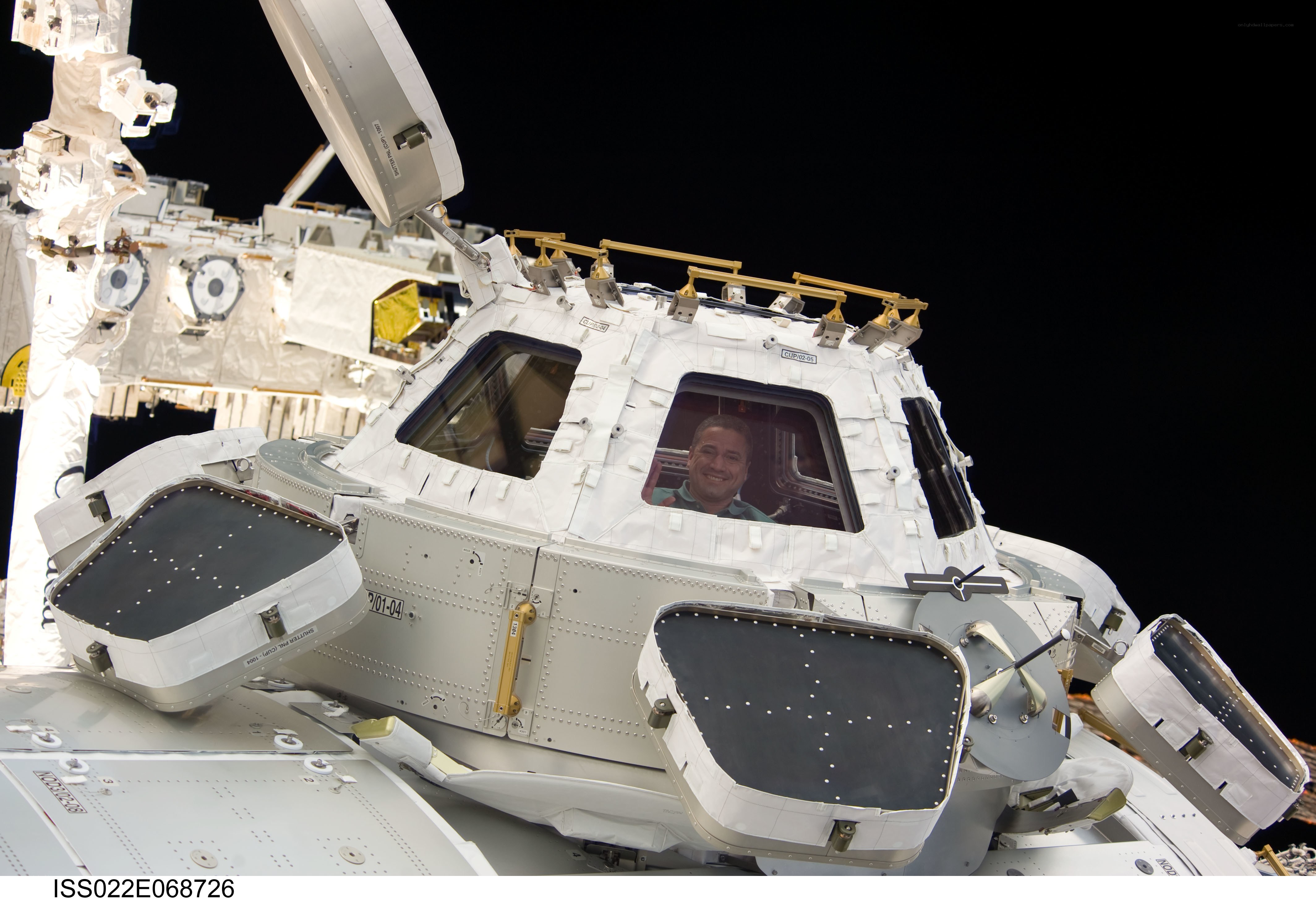 Astronaut in space station module