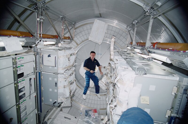 Astronaut in space station module