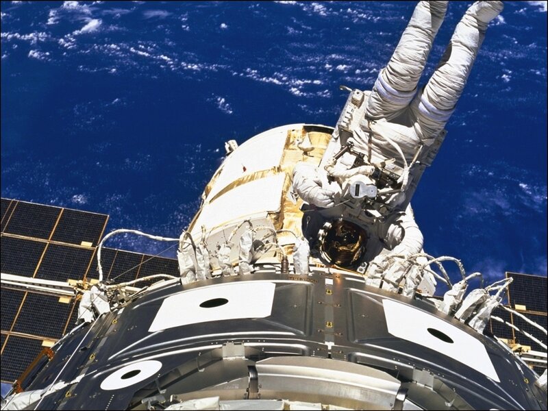 Astronaut in Space Suit — Blue, Dramatic, Photograph, Spacecraft
