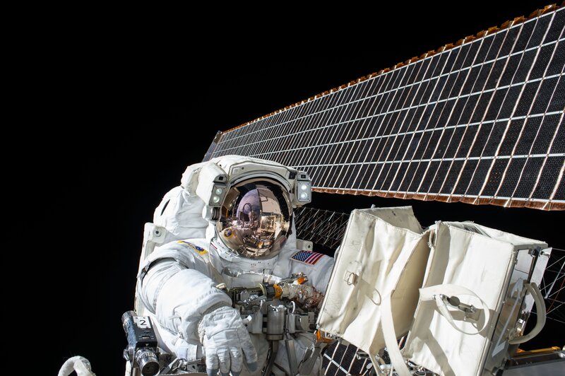 Astronaut in Space Suit — White, Dramatic, Night, Photograph, Solar Panel