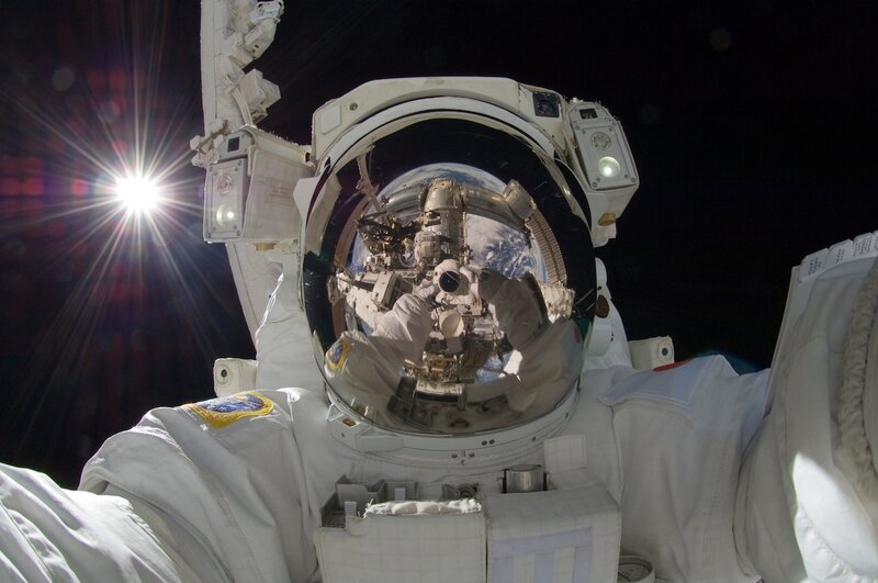 Astronaut in Space Suit — White, Dramatic, Photograph, Earth, Space Station