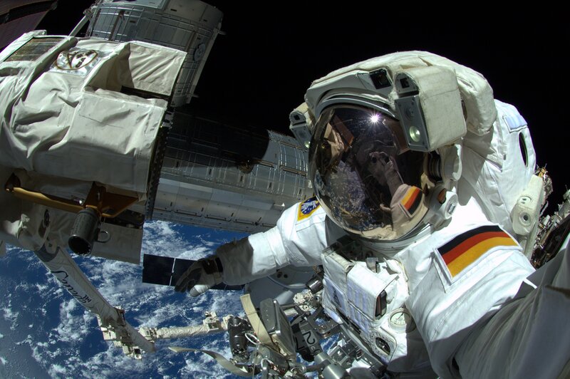 Astronaut in Space Suit — White, Dramatic, Photograph, Space Station, Earth, Planet