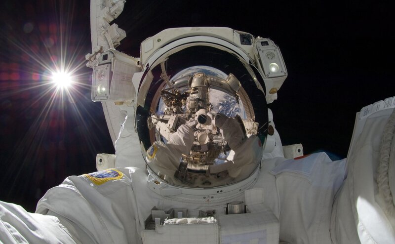 Astronaut in Space Suit — White, Dramatic, Photograph, Space Station, Earth, Sun