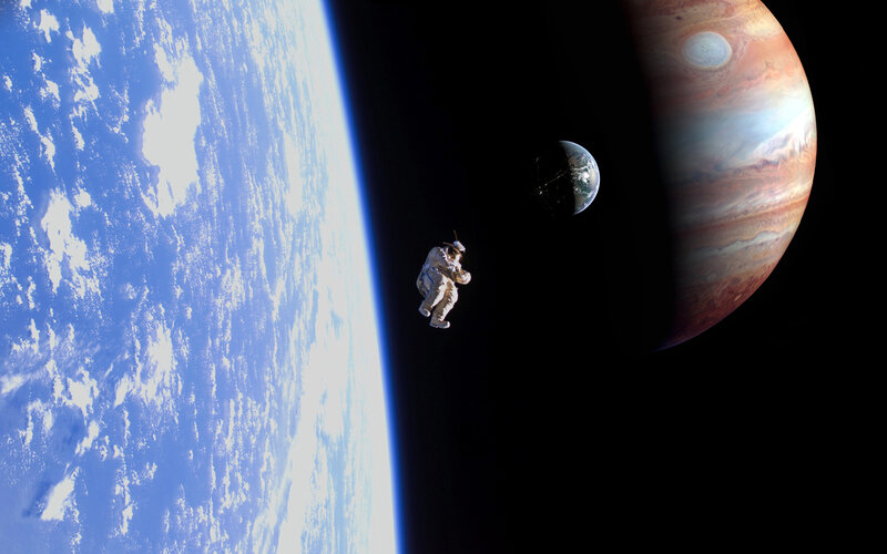 Astronaut in space with planets