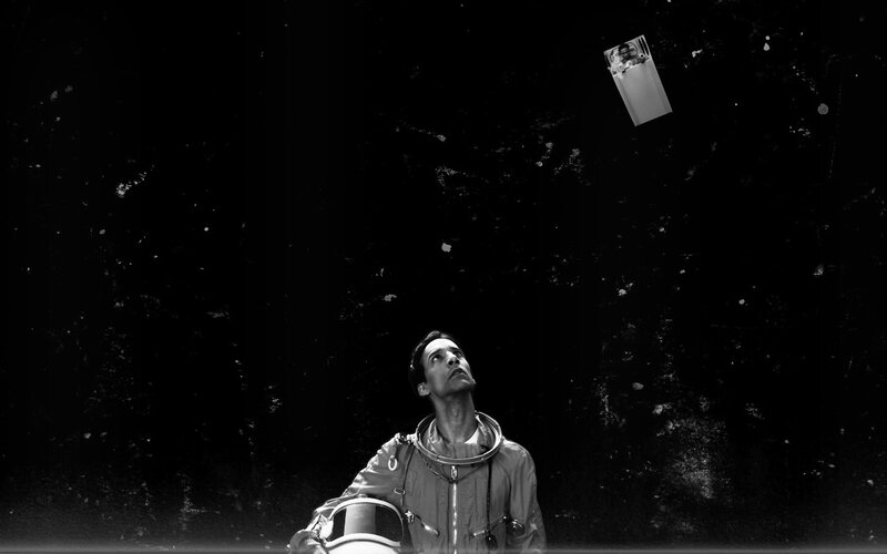 astronaut looking up at object