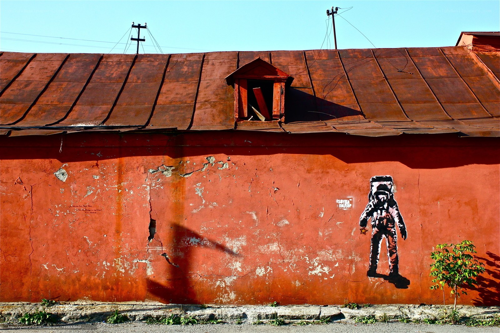 Astronaut mural on a red wall