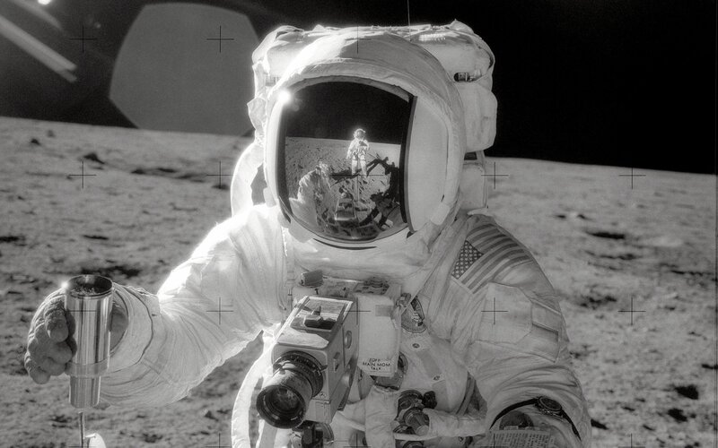 Astronaut on Moon Surface — Black, Dramatic, Photograph, Space Suit, Camera