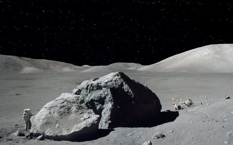 Astronaut on Moon Surface — Gray, Desolate, Night, Photograph, Rock