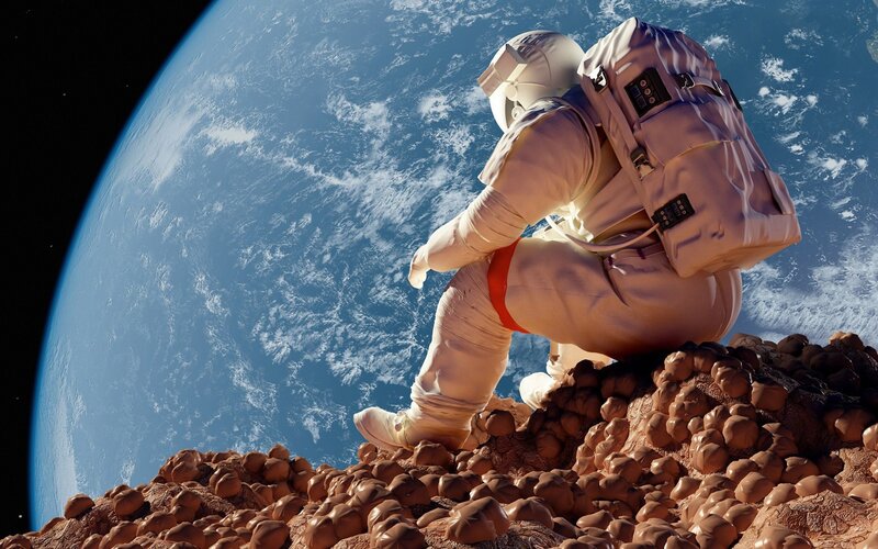 Astronaut on Rocky Surface — Blue