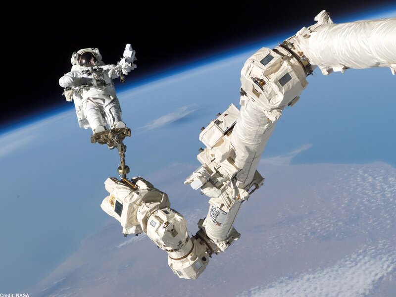 Astronaut Performing Spacewalk — White, Dramatic