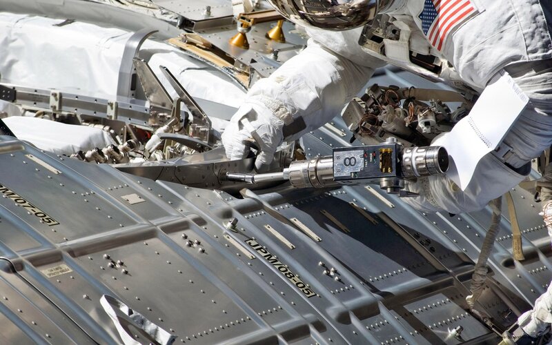 Astronaut Performing Spacewalk — White