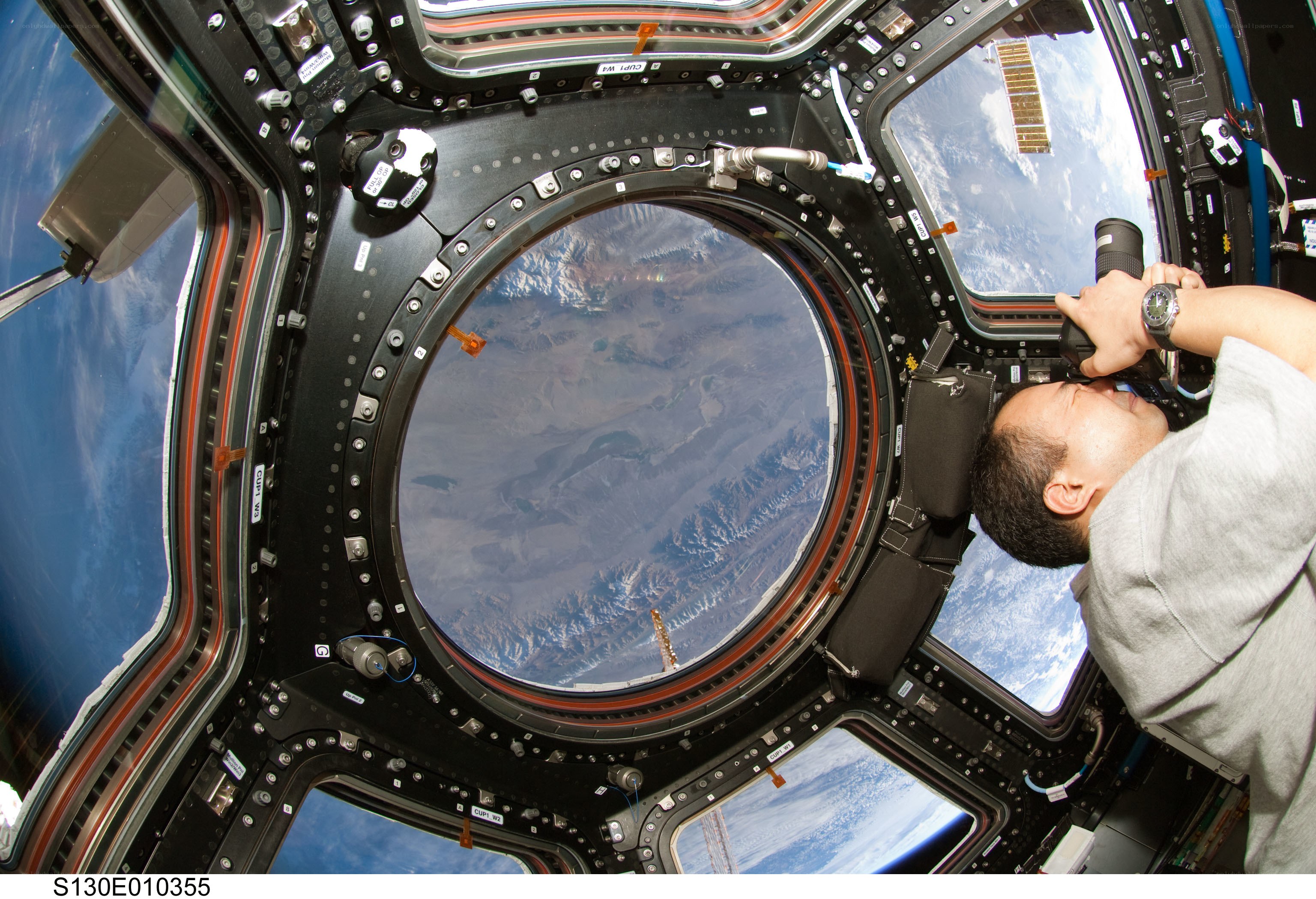 Astronaut photographing Earth from space