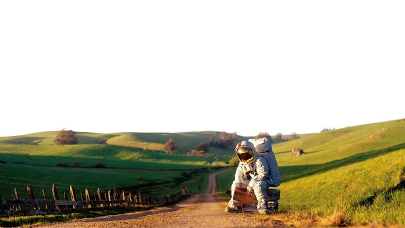 Astronaut Sitting on Road — Green, Serene, Afternoon