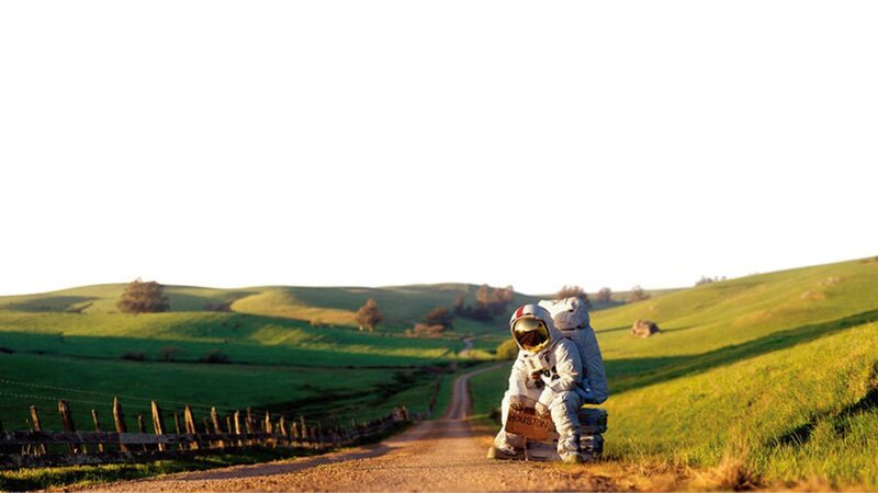 Astronaut Sitting on Road — Green, Serene