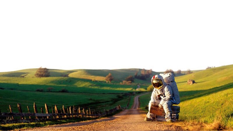 Astronaut Sitting on Road