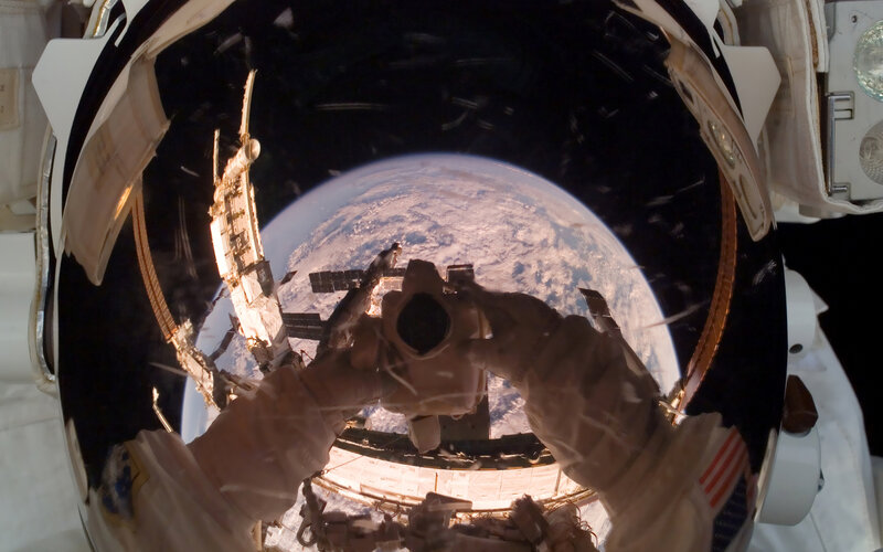 Astronaut taking photo of Earth