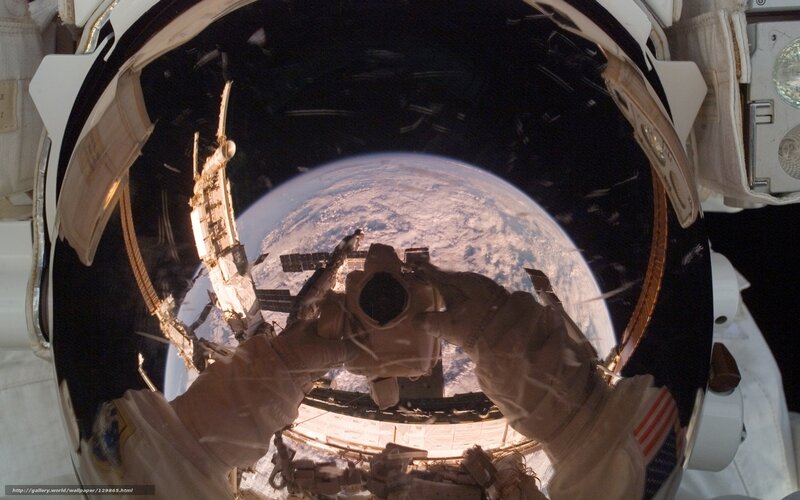 Astronaut taking photo of Earth