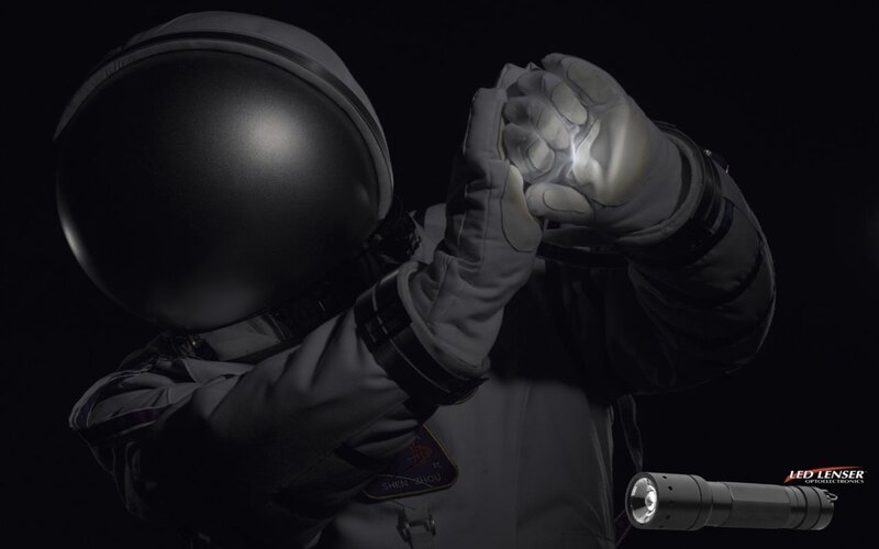 astronaut with flashlight