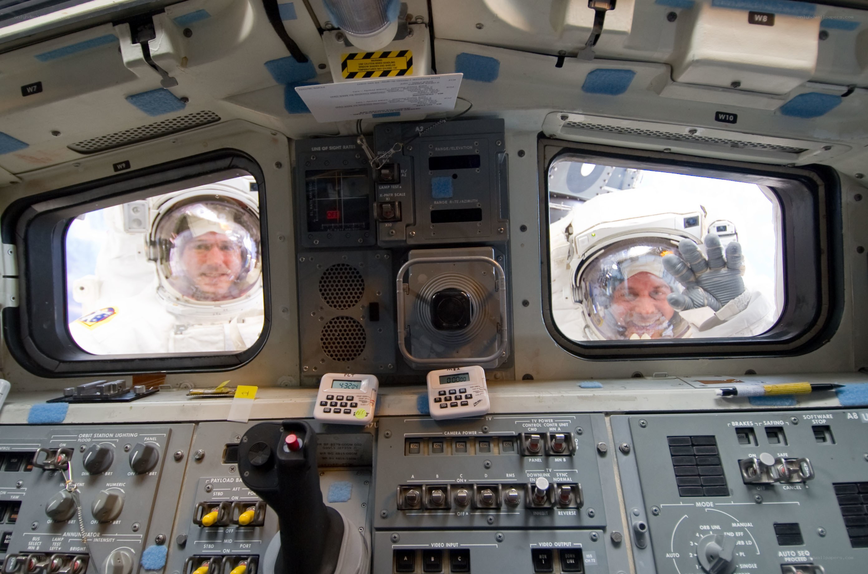Astronauts in space shuttle