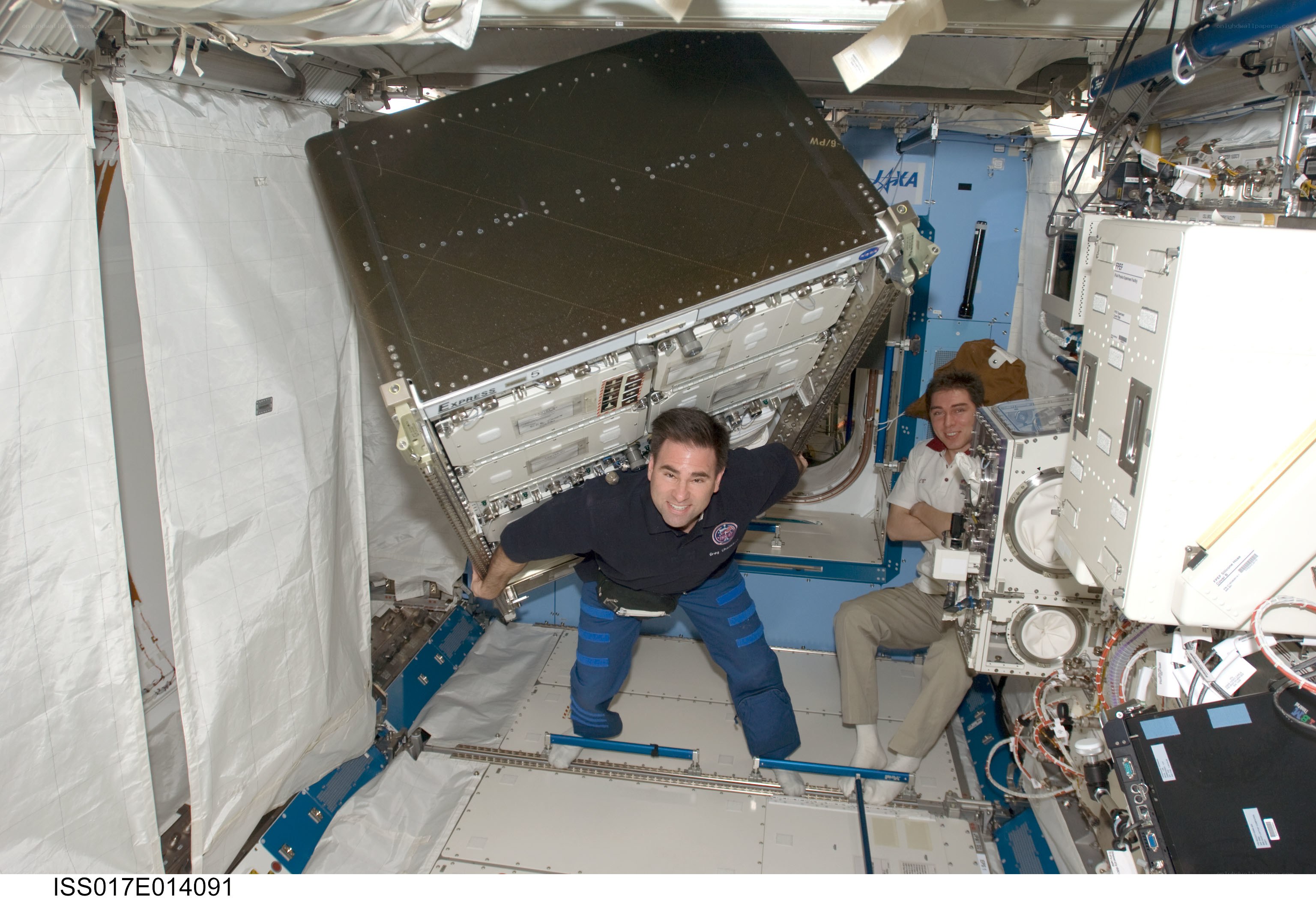 Astronauts in space station module