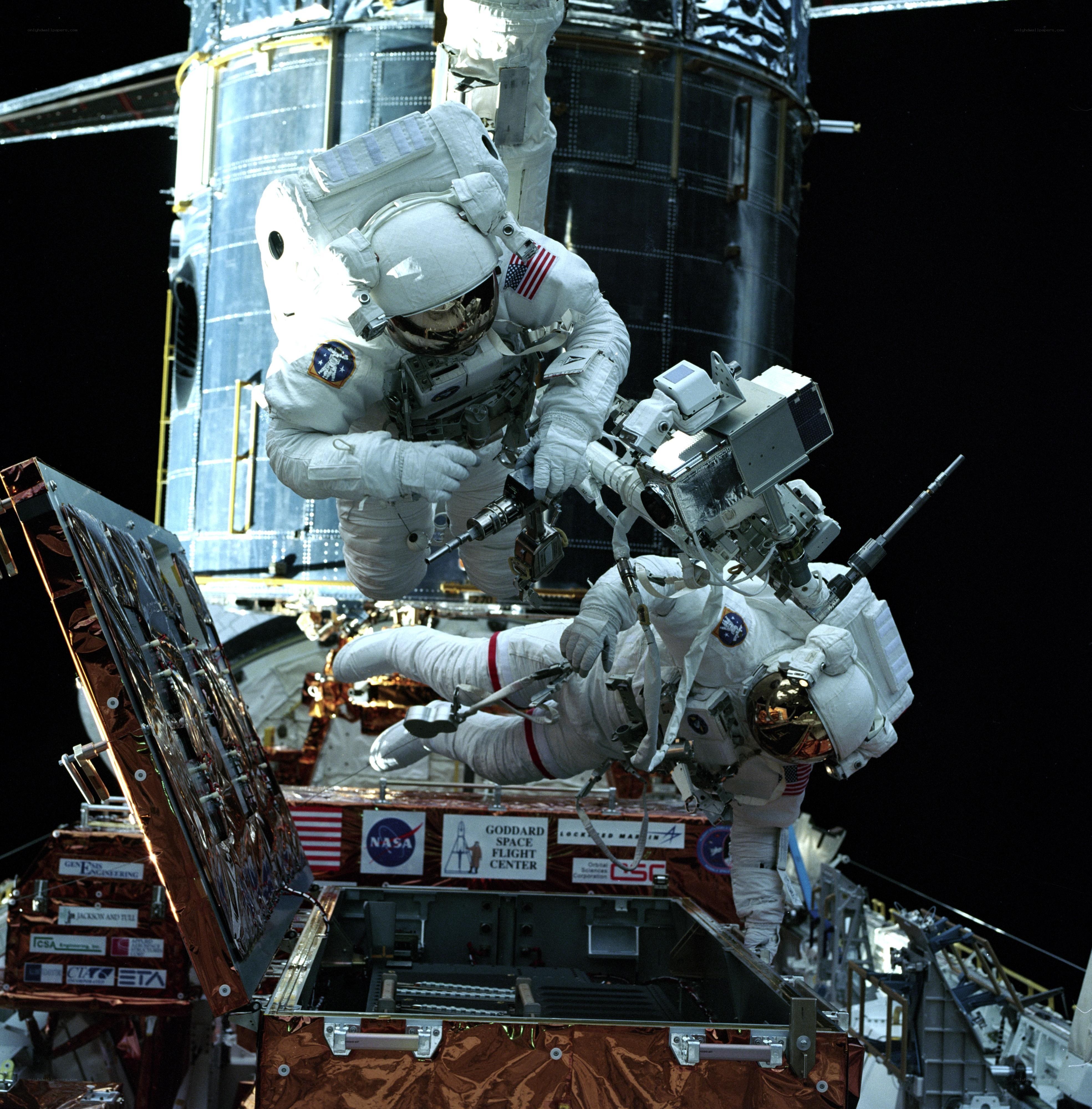 Astronauts in spacewalk