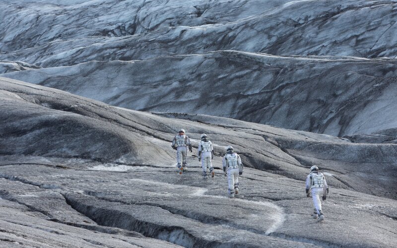 astronauts on alien terrain