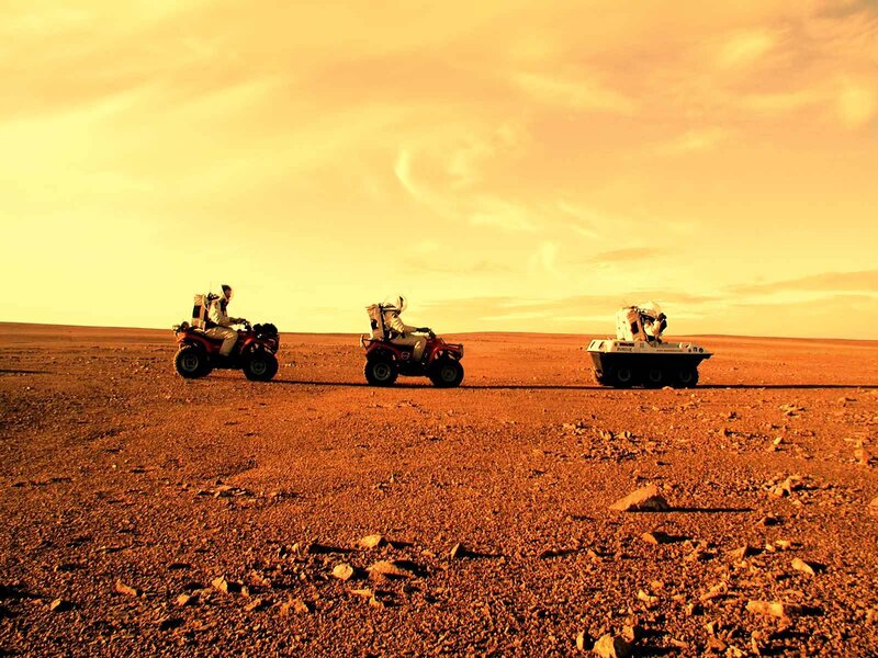 Astronauts on Mars terrain