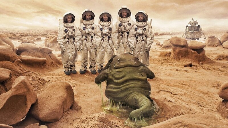 Astronauts on Mars with alien creature