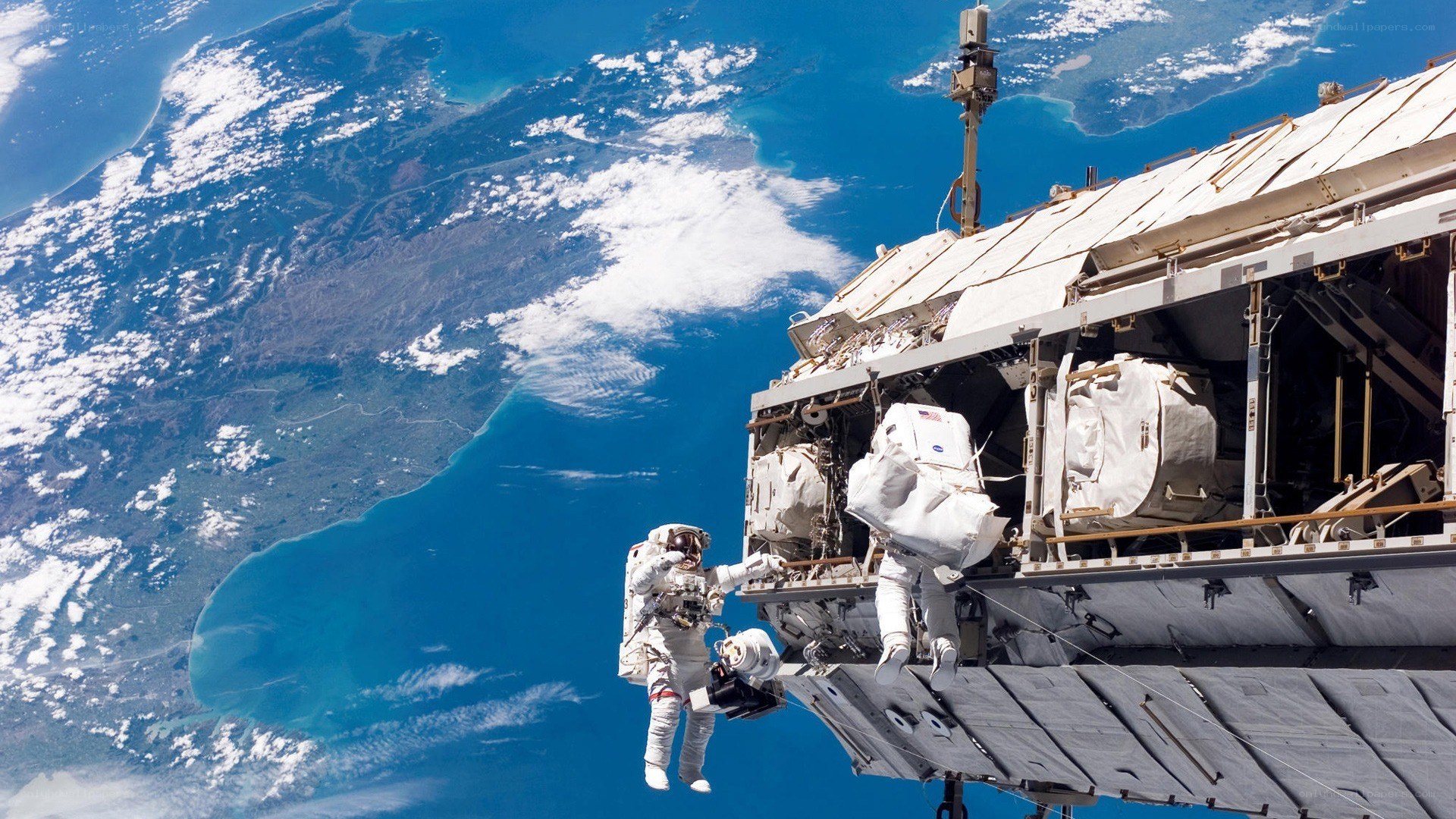 Astronauts on spacewalk