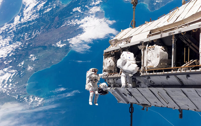 Astronauts on spacewalk