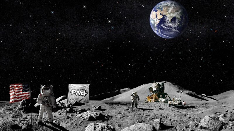Astronauts on the Moon with Earth in view