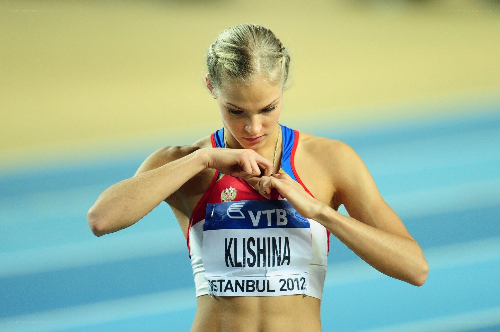 Athlete adjusting bib at event