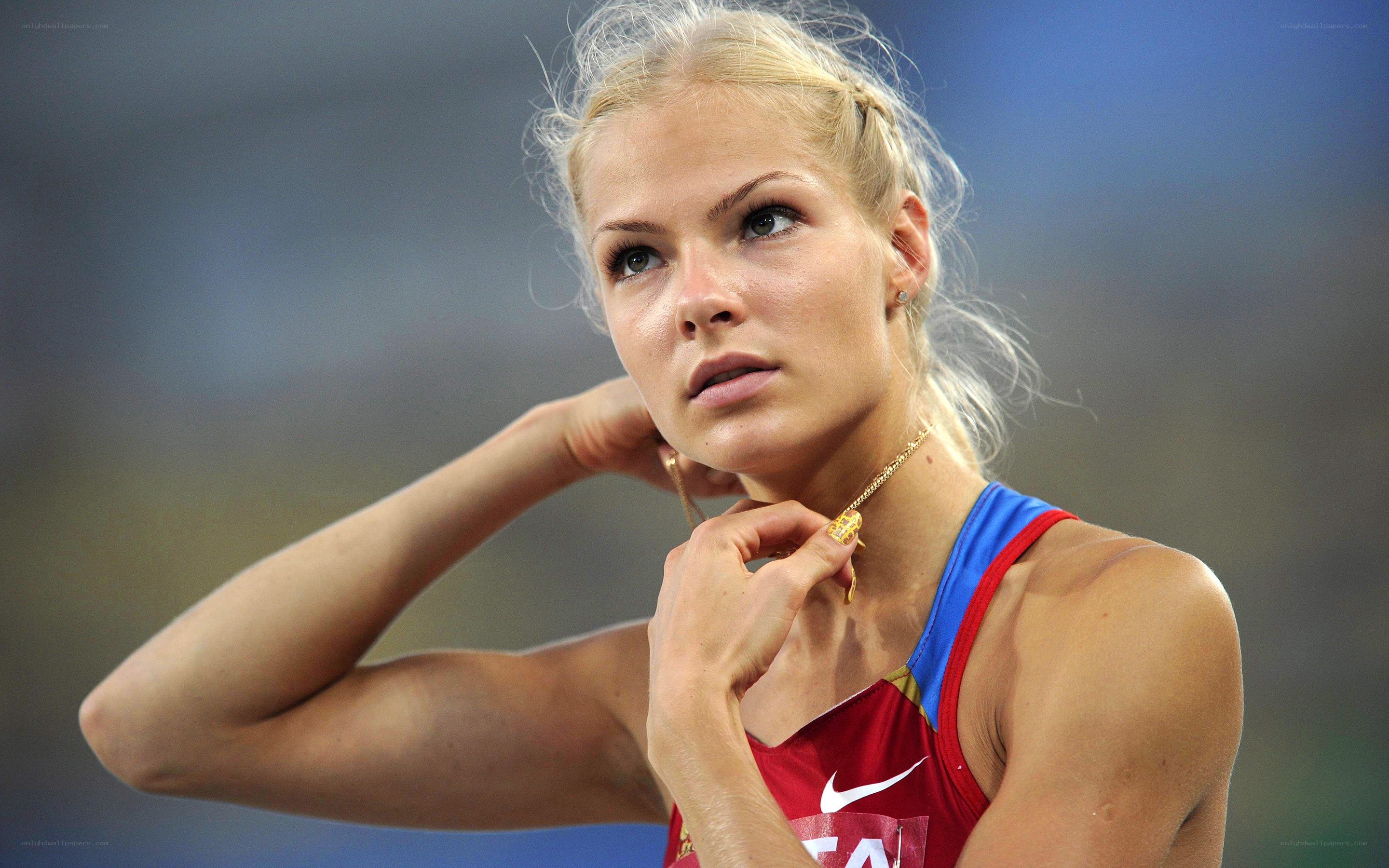 athlete adjusting necklace