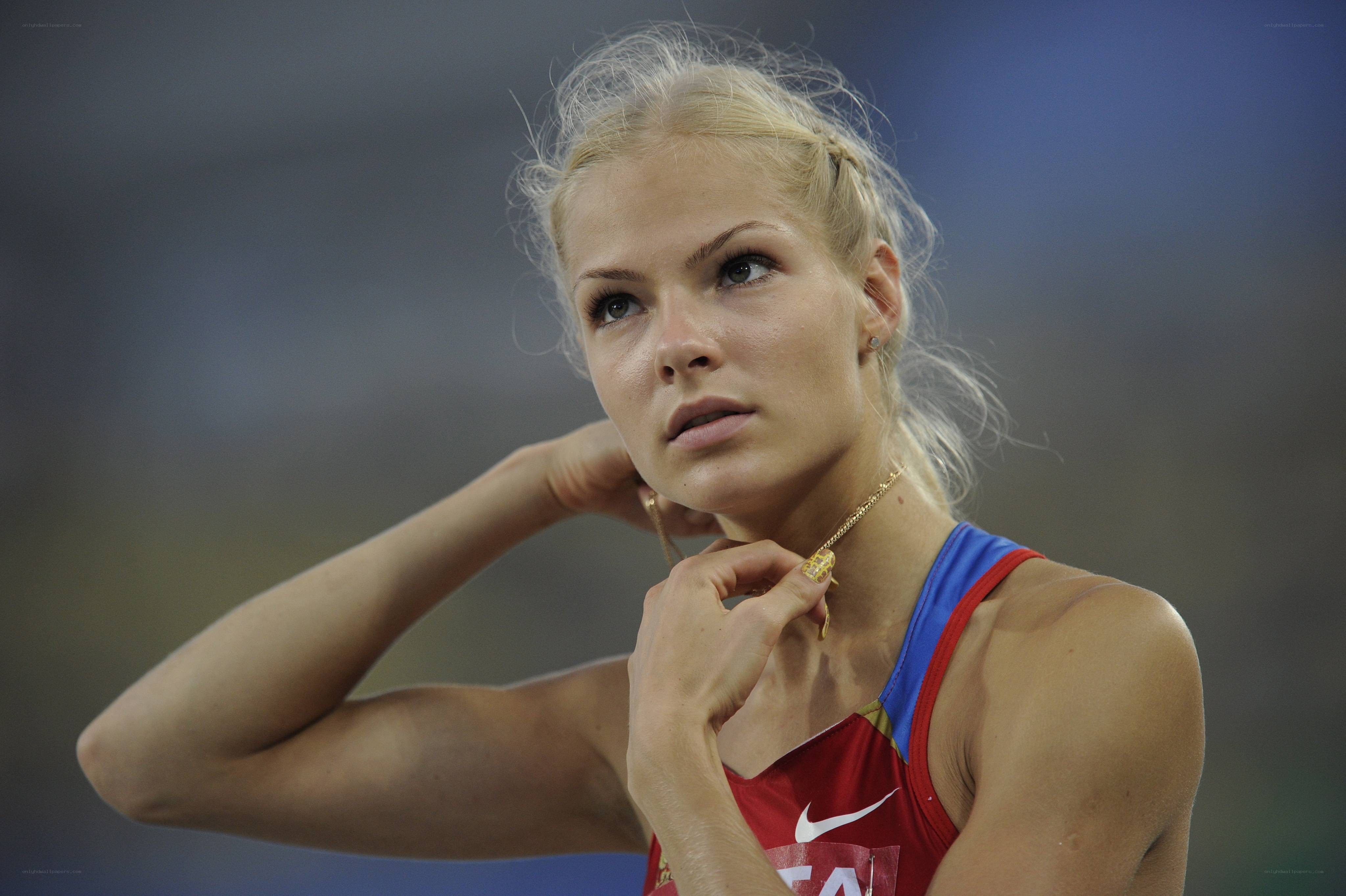 athlete adjusting necklace