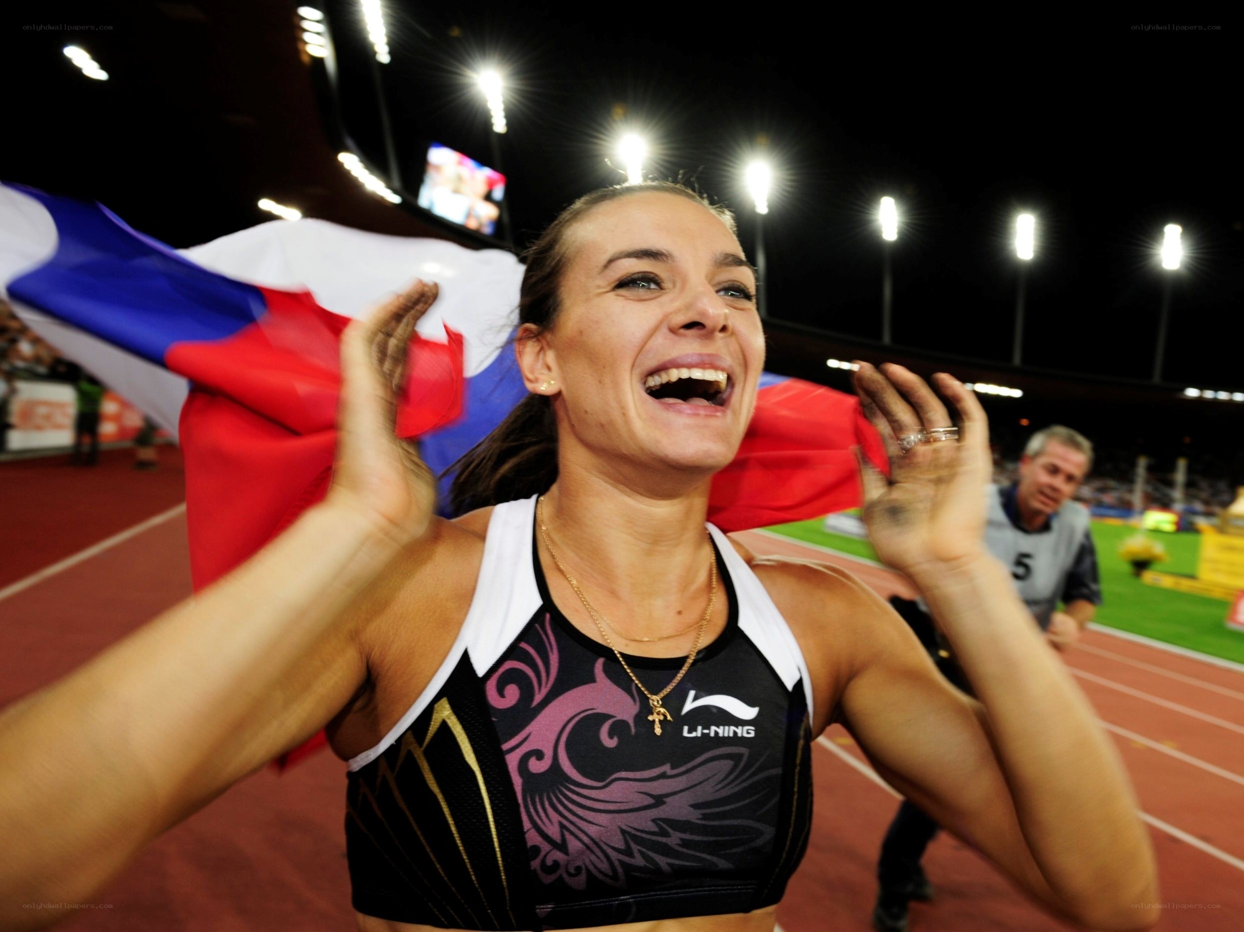 Athlete celebrates with flag