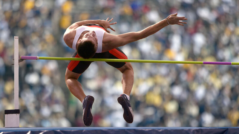 Athlete Clearing Bar