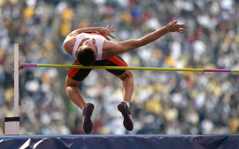 Athlete Clearing High Jump Bar