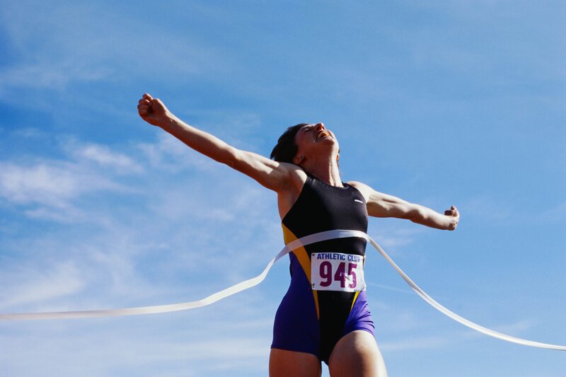 athlete crossing finish line