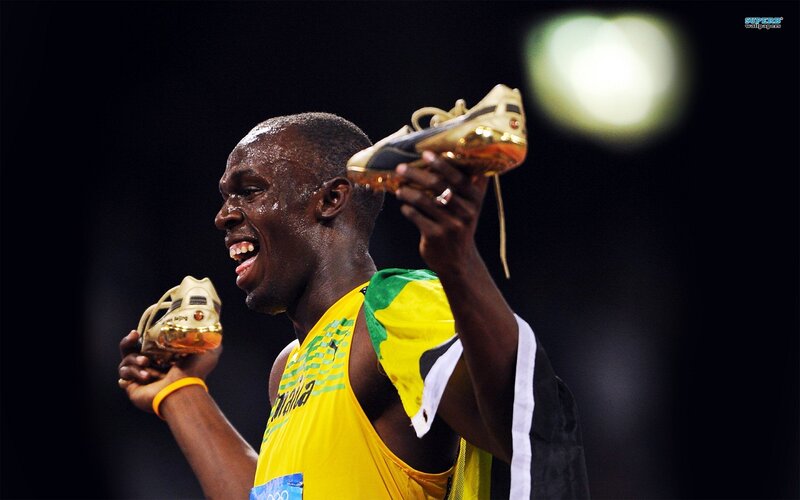 Athlete Holding Shoes