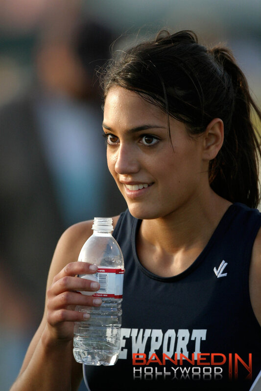 athlete holding water bottle