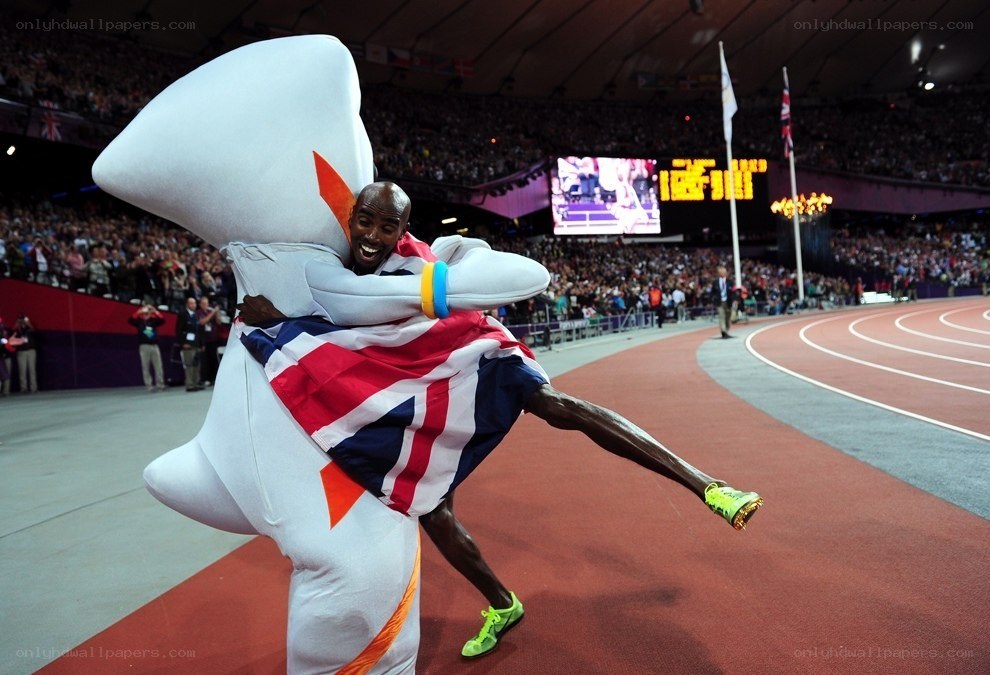 Athlete hugging mascot