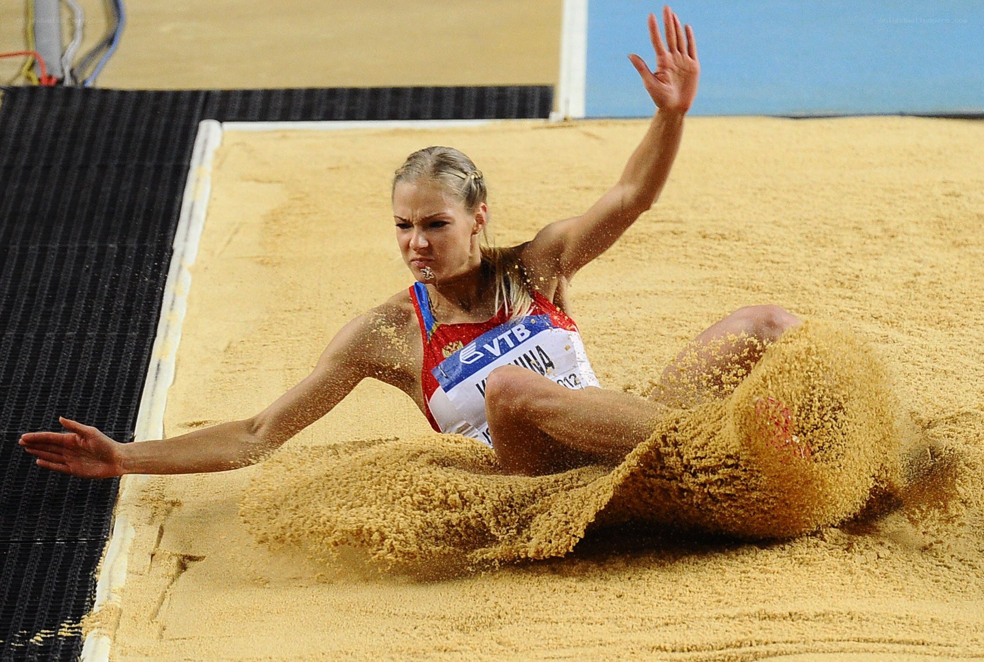 athlete in sand pit