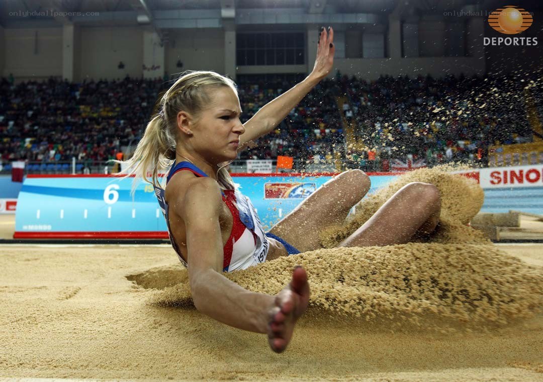 athlete in sand pit